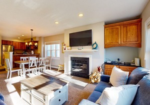 Ski-in/out condo near lifts with a fireplace, pool, hot tub, & tennis