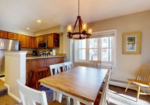 Ski-in/out condo near lifts with a fireplace, pool, hot tub, & tennis