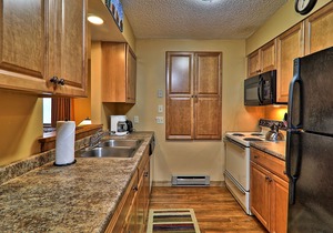 Ski-in/out condo with fireplace, tennis court, mountain views, & washer/dryer