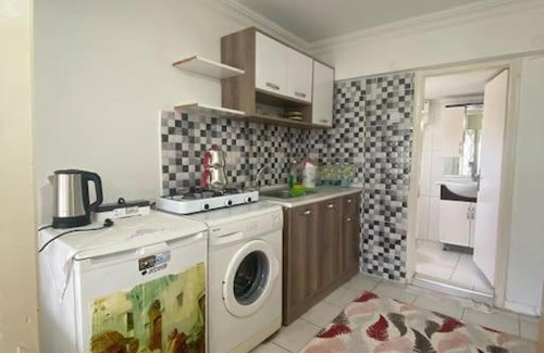 Lara Apartment | Özel plajlı sitede bahçe katı