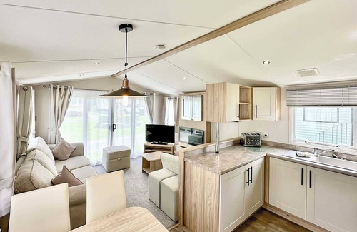 Cross Inn House | 12ft-wide luxury caravan with one double with en suite shower and one twin.