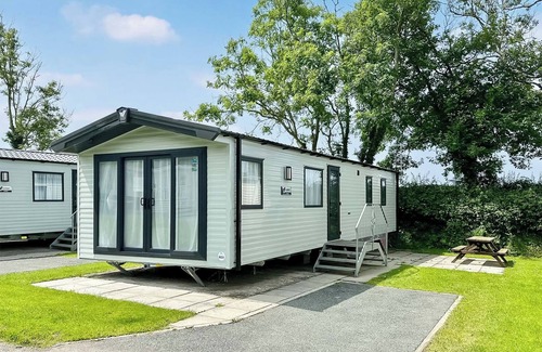 Cross Inn House | 12ft-wide luxury caravan with one double with en suite shower and one twin.