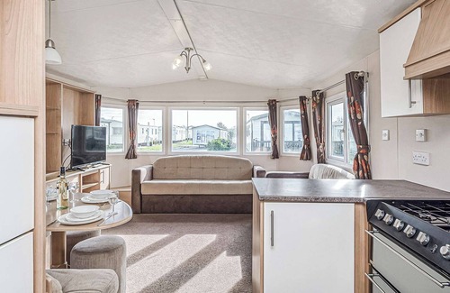 Maryport House | 12ft-wide quality caravan with one double and two twin.