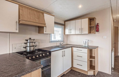 Maryport House | 12ft-wide quality caravan with one double and two twin.