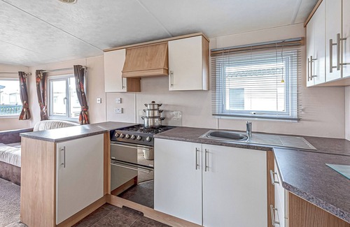 Rhyl House | 12ft-wide quality caravan with one double and two twin.