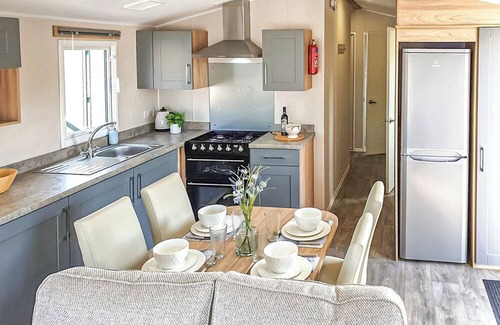 Chapel Saint Leonards House | 12ft-wide stylish and comfortable caravan with one double and two twin.