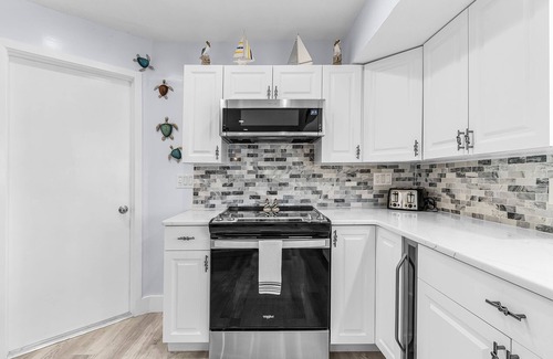 Saint James City House | 2/2 Pool Home on the Water, Boat Lift Included!