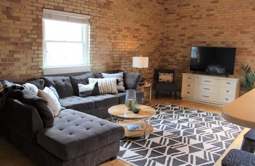 Grand Haven Condo | 2 BD/2BA Modern Condo in the Historic Downtown Armory