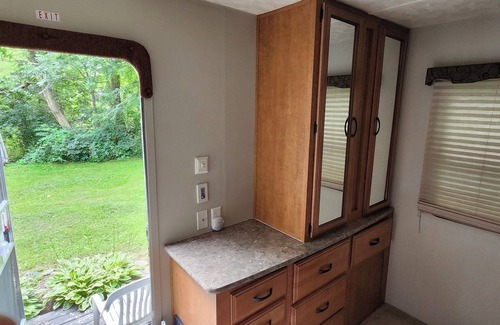 Wisconsin Dells RV Rental | 2-bedroom camper w Br/Ac + access to Happy Place Fish Farm utilities/recreation.