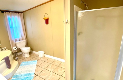 Ramer House | 4 bd rm, 2bth modular, feat. full ktch, private deck & grill at Kick Back Ranch.