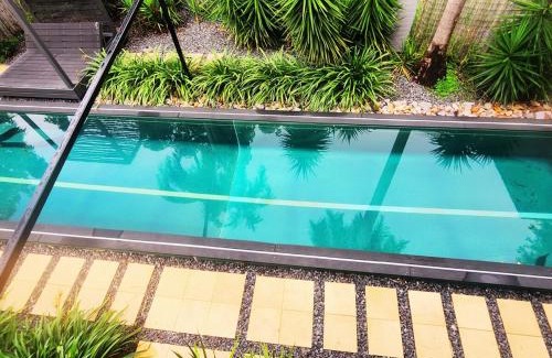 Wagaman House | 4 BDR Airconditioned Tropical Escape, Lap Pool & Parking for Caravans, Boats and Trailers