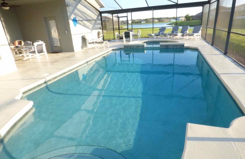 Crescent Lakes House | 4 Bedroom Home in Gated Area on the Lake withSolar Heated Large Pool with Spa