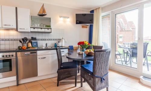 Kronsgaard Apartment | 4 Sterne-Terrassen-Fewo "Heimathaven" direkt am Ostseestrand inkl Schwimmbad