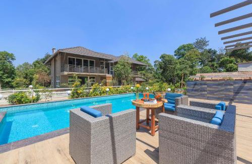 Virajpet Villa | 5BR Coffee & Mist Luxury Villa- Comp Breakfast, Pvt Pool, and Coffee Estate by StayVista
