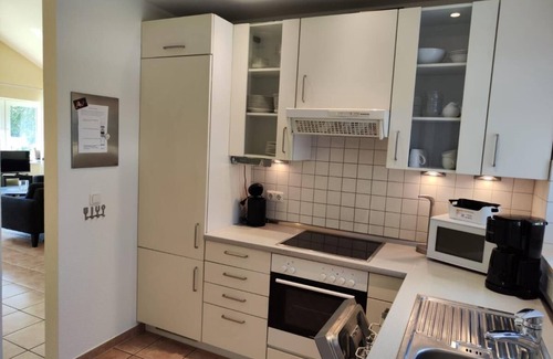 Norderteil House | 6 person vacation home with private jetty, direct lakeside location, canoe, sauna and bathtub in Otterndorf