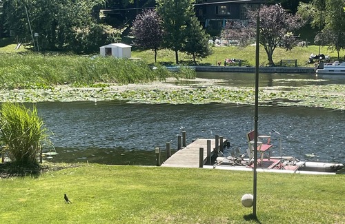 Ludington Cottage | #8 cottage comes with boat docks and shares over 600’ of frontage on Hamlin lake