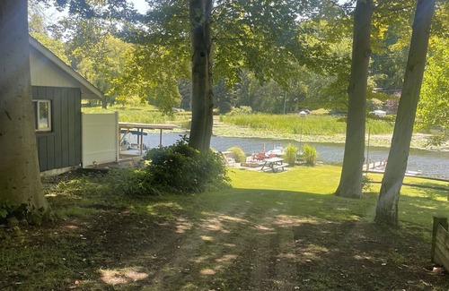 Ludington Cottage | #8 cottage comes with boat docks and shares over 600’ of frontage on Hamlin lake