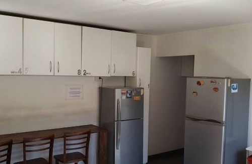 Pudahuel Apartment | ¡8 minutes from the airport! Room with a shared bathroom at a traveler's house