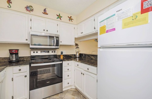 Caswell Beach Condo | A Breath of Heaven: First Floor Condo with Stunning Views, Community Pool, Beach