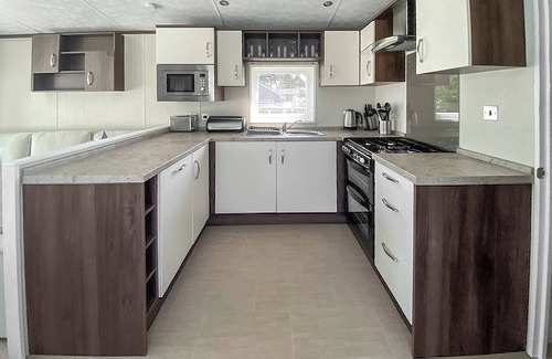 Langham House | A cosy holiday home with one master double and one twin room.