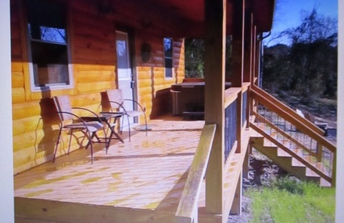 Carbon Hill Cabin | A cozy new cabin in rural setting with a hot tub on porch. Beautiful rural view.