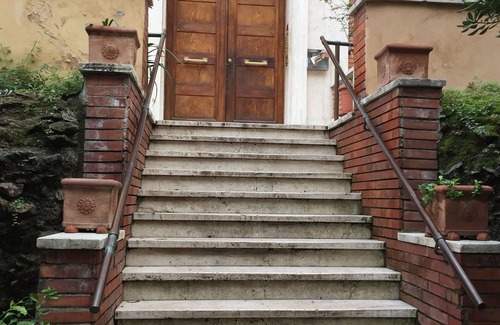San Giovanni Apartment | a house with many outdoor spaces in the center of rome.