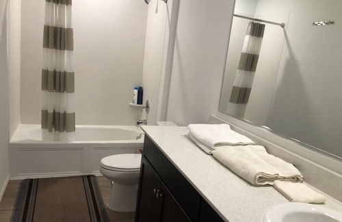 Princeton Condo | A master bedroom suite with its own bathroom and kitchen