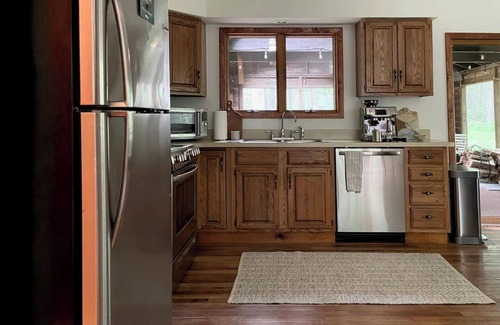 Yulan Cabin | A peaceful, quaint cabin in the woods offers a country-side escape for couples, small families, and friends.