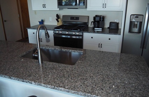 Elk Rapids Cottage | A Short's Walk - Sandy Lakefront with Spa/Hot Tub and Kayaks!