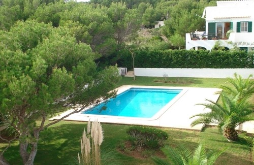Arenal d'en Castell Ski Chalet | A stylish villa on the beach, with garden, pool and WIFI . pure rest