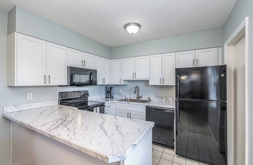 Port Canaveral Condo | Affordable 2BR Main floor unit RIGHT ON THE BEACH! 1 King & 2 Queen Beds.