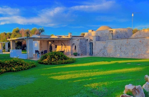 Ostuni Villa | "Al Guappo D'oro," trullo with pool nestled in the Apulian countryside.