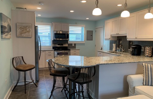 St. Pete Beach Condo | Amazing beach condo with coastal vibes - beachside/poolside - 2 BR/Ground floor!