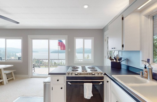 Harrison House | Amazing lake-view cabin with balcony, firepit, grill, wood stove, & W/D