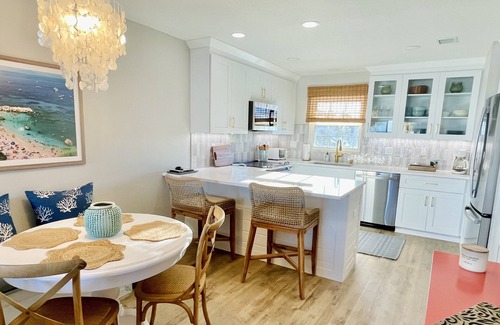New Smyrna Beach Condo | Amazing views of the ocean and pool from this coastal-modern, surfer-chic condo!