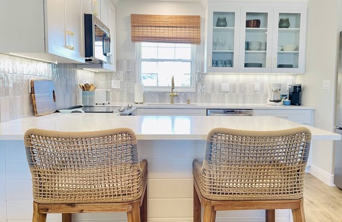New Smyrna Beach Condo | Amazing views of the ocean and pool from this coastal-modern, surfer-chic condo!