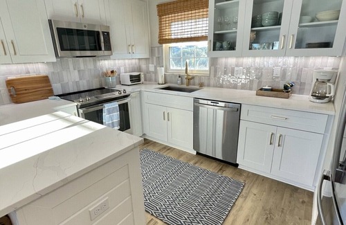 New Smyrna Beach Condo | Amazing views of the ocean and pool from this coastal-modern, surfer-chic condo!