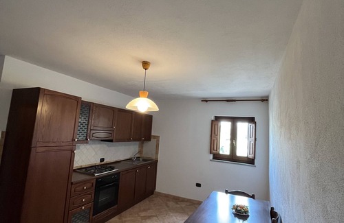 Sa Castangia House | Ancient building in the historic center near the lake and the sea.