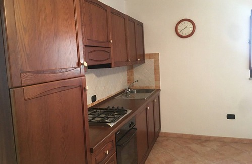 Sa Castangia House | Ancient building in the historic center near the lake and the sea.