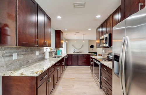 Palm City House | Angler's oasis with dock, boat lift, river views, hot tub, & furnished patio