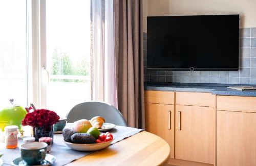 Spiekeroog Apartment | Antares Spiekerooger Gästehaus-Sonnengartenbalkon Nord - Wohnung 5
