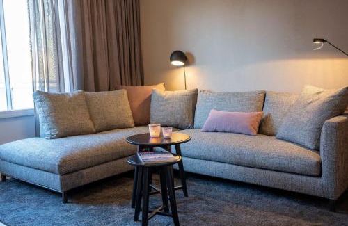 Spiekeroog Apartment | Antares Spiekerooger Gästehaus-Sonnengartenbalkon West - Wohnung 6