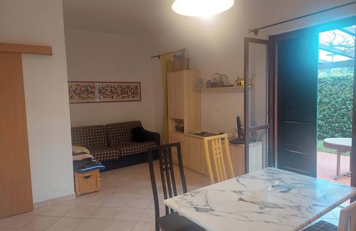 Cavo Apartment | Apartment Cala Azzurra - with large garden and a stone's throw from the sea