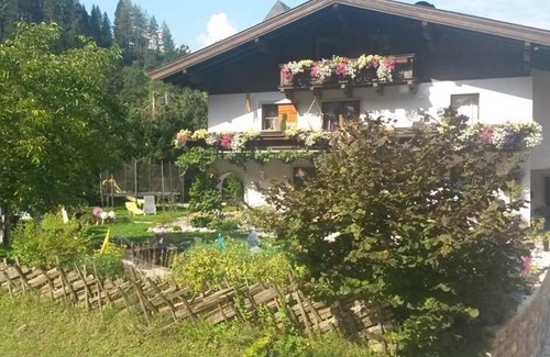 Leogang Apartment | Apartment Harmonie & Balance - Apartment Harmonie, terrace and swimming pond