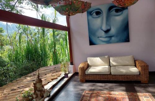 La Estrella Villa | Artsy lush villa with jungle garden in the city