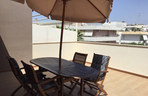 Pozzallo Apartment | Attic, stylishly furnished, large terrace and sea view, 5 min. to the beach.