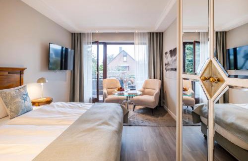 Strande Hotel | Büngers Apartment-Hotel mit Sommerstrandkorb & Gartensauna