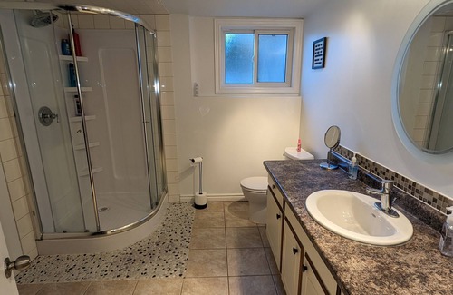 Kitchener House | Backyard Oasis with Pool, Hot tub & Fire table. 4 bedrooms, gym, & a yoga area!
