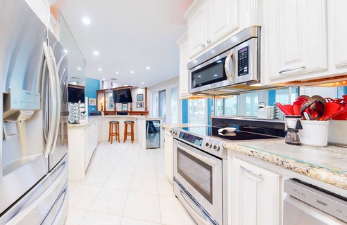 Port Isabel House | Bayfront home with dock, private elevator, central AC & grill -snowbird-friendly