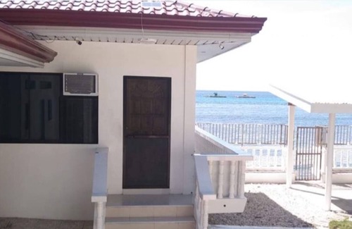 Oslob Apartment | Beach front Studio UnitnPet friendlynBig yard and cottage